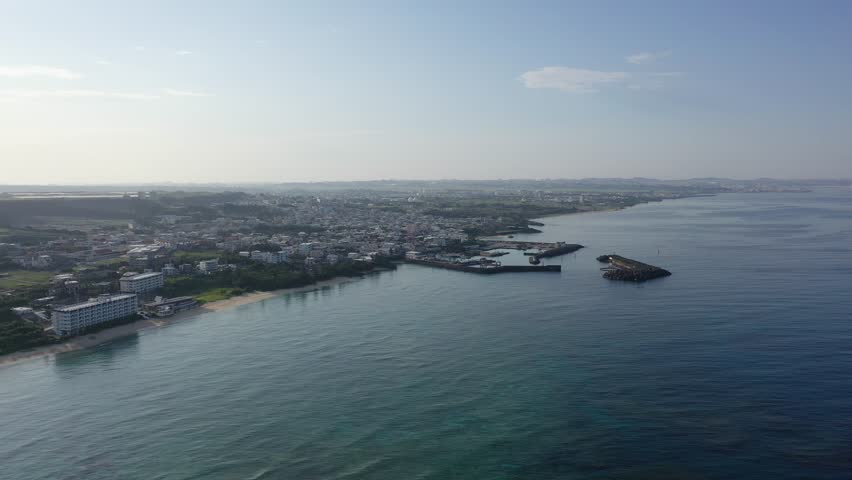 A view of the calm sea, bay and buildings