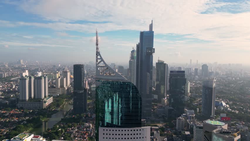 Jakarta, Indonesia: Aerial drone footage of Jakarta business and financial district in early morning light in Indonesia capital city on a Java island. Royalty-Free Stock Footage #1102154841