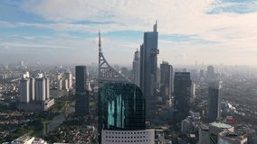 Jakarta, Indonesia: Aerial drone footage of Jakarta business and financial district in early morning light in Indonesia capital city on a Java island.