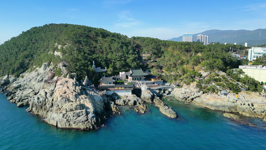Busan, South Korea: Aerial view of famous seaside Buddhist temple Haedong Yonggungsa, sunny day with blue sky - landscape panorama of Eastern Asia from above