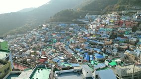 Busan: Aerial view of city in South Korea, famous Gamcheon Culture Village, kaleidoscopically coloured village on sunny day - landscape panorama of Eastern Asia from above