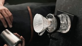 brewing coffee with the V60 method. vertical video 