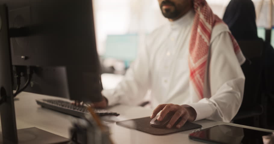 Arab Telecommunications Manager Working in a Research and Development Facility on a Desktop Computer. Focused Middle Eastern Software Engineer Updating Server System Database. Slow Motion Footage Royalty-Free Stock Footage #1102168945