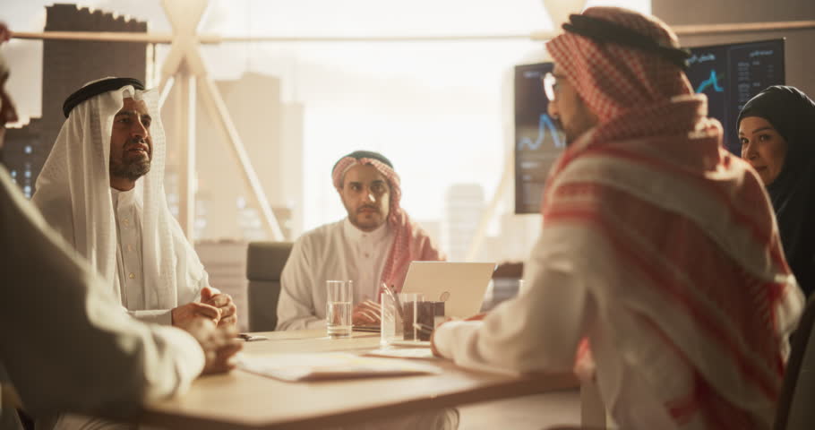 Middle Eastern Business Partners Striking a Successful Deal at a Corporate Modern Meeting Room. Two Arab Men Shaking Hands, Managers in Traditional White Robes Celebrating and Clapping Hands Royalty-Free Stock Footage #1102169065