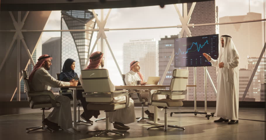 Muslim Businessman Holds Meeting Presentation for Diverse Business Partners. Manager Uses Digital Display with Growth Analytics, Charts, Statistics and Data. Saudi, Emirati, Arab Office Concept Royalty-Free Stock Footage #1102169121