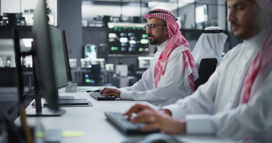 Group of Multicultural Middle Eastern Men and Women Working in Research Center, Collaborating and Discussing a Project, Using Computers to Write Software Code, Develop Artificial Intelligence Service Royalty-Free Stock Footage #1102169181