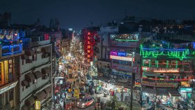 Timelapse view of traffic on Main Bazaar street in the vibrant Paharganj Market at night in Central Delhi, India. - Powered by Shutterstock - Get 15% off with code: PIKWIZARD15