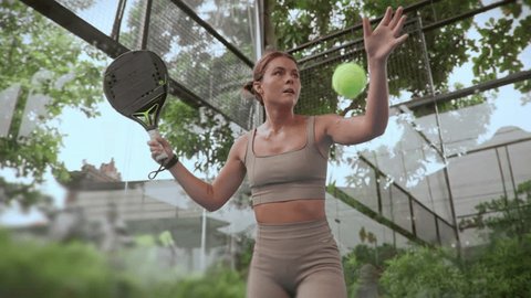 Woman player serve ball close up. Young adult girl play tennis slow motion. Female person racket beat game. People hitting sport court match. Fit care free time. Run skill club. Paddle tennis slow mo. 스톡 비디오