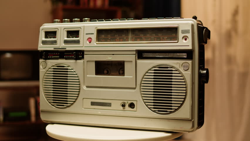 Retro radio tape recorder close-up. Listening to music, old radio boombox player, searching channel.  Royalty-Free Stock Footage #1102175385