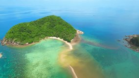 The turquoise waters and pristine beaches, sandbar create a breathtaking view, making it an ideal place for swimming and sunbathing. (Koh Ma, Koh Phangan, Thailand). bird's eye view from drone. 
