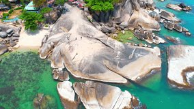Hin Ta Hin Yai, also known as the Grandfather and Grandmother rocks, is a popular tourist attraction located on the southern coast of Koh Samui in Thailand. tropical and summer concept. 4K Drone
