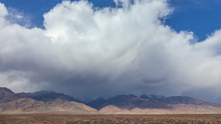 Time lapse majestic view of clouds over the mountains, seen with beautiful dramatic clouds.
Clouds moving across the mountains.