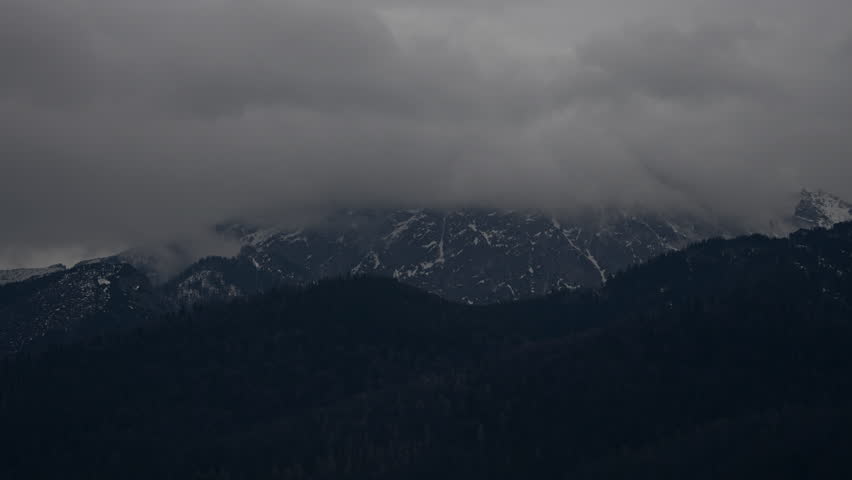 Time lapse showing clouds moving over the most famous mountain in Poland. Mount Giewont in the Polish Tatras. Zakopane, Poland