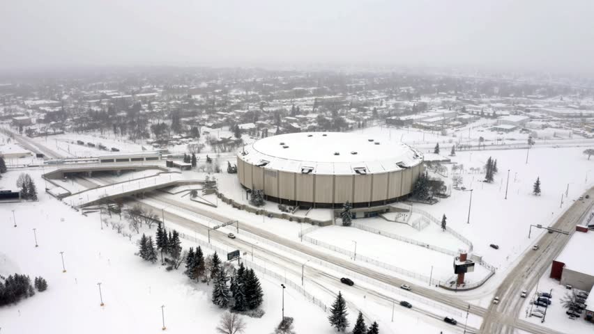 Edmonton, Alberta, Canada. Aerial view of the Northlands Coliseum Arena (Edmonton Oilers old home arena). The train arrives at the station