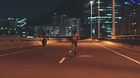 Women training in city street at night and athlete exercise running. Sports fitness runners, health motivation race workout road energy together cardio outdoor dark sprint practice for competition - Powered by Shutterstock - Get 15% off with code: PIKWIZARD15