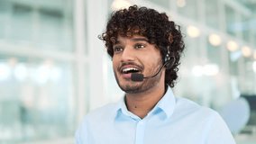 Close up. A corporate operator who works in the support service speaks on a video call. A call center agent in a wireless headset helps a customer with a complaint in a office by answering questions - Powered by Shutterstock - Get 15% off with code: PIKWIZARD15