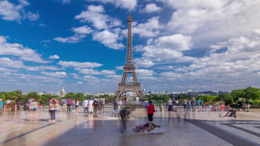 Trocadero square with Eiffel tower in the background timelapse hyperlapse. Trocadero and Eiffel tower are the most visited attractions of Paris. Blue cloudy sky at summer day Royalty-Free Stock Footage #1102196759