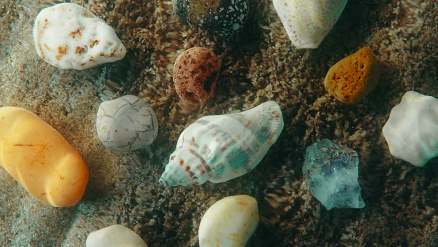 Top down view seabed background, sea floor beach sand ripple of water waves reflection, shells and stones. Sandy bottom surface summer. Underwater seafloor backdrop close-up Royalty-Free Stock Footage #1102198223