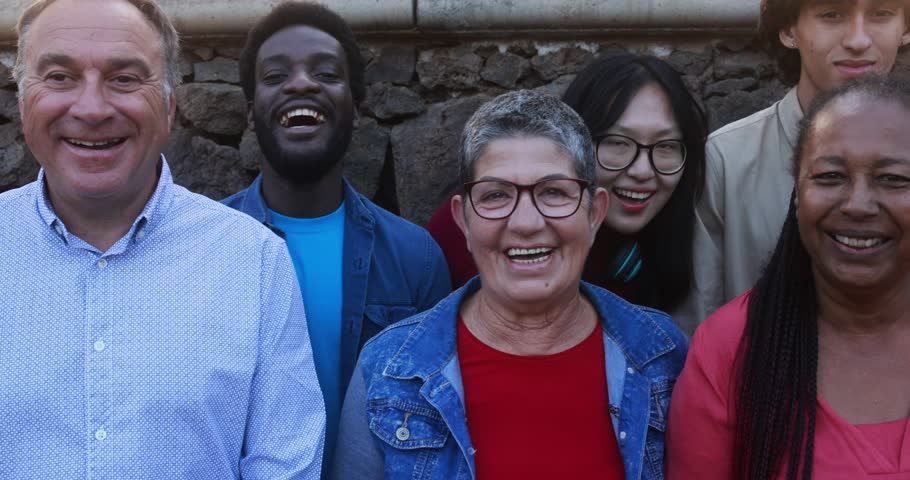 Group of multigenerational people smiling in front of camera - Multiracial friends with different ages having fun together at city park  | Shutterstock HD Video #1102198725