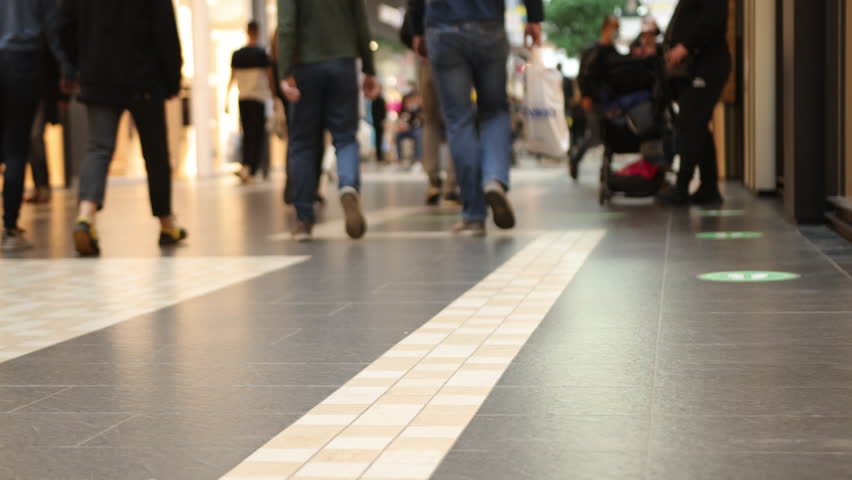 store interior, crowd walking, fashion mall. Close-up of legs with shopping bags at, selective focus, crowd walking across modern floor of modern shopping mall with so many people Royalty-Free Stock Footage #1102202487