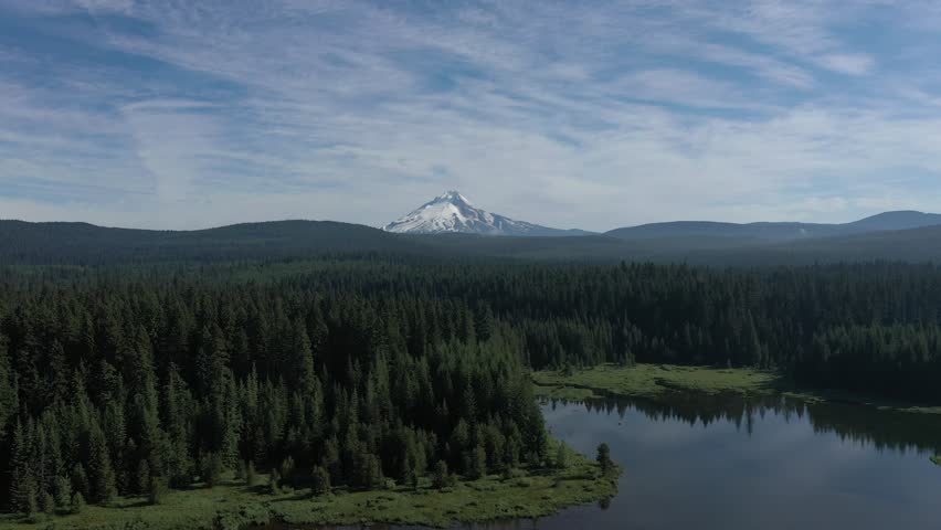 Scenic aerial orbit shot of Mount Hood seen from Timothy Lake in Oregon.