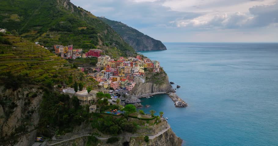 Town of Manarola Cinque Terre Italy Liguria famous historic town of colorful houses on the cliffs of Mediterranean Sea Drone view Royalty-Free Stock Footage #1102203809