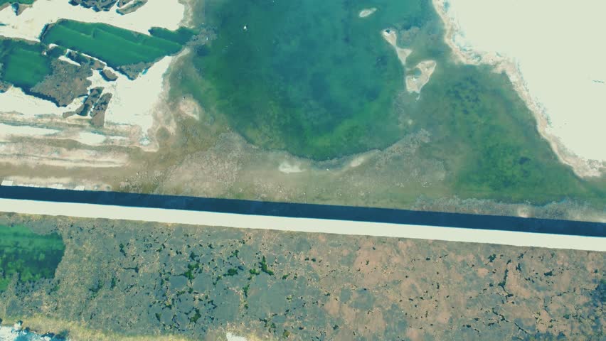 Aerial view of blue water lake and green summer woods in Finland.