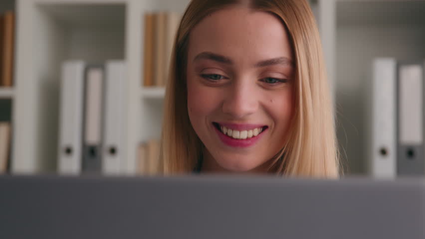 Caucasian woman remote job from home office surprised girl businesswoman smile online communication in social media typing laptop good news win chatting computer smiling good work result happy study
