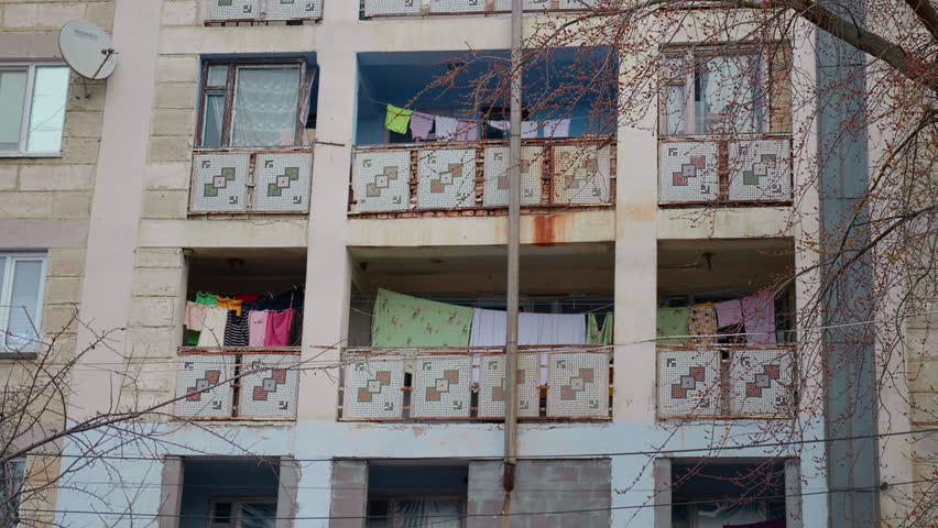 Specific balcony style from concrete Post Communist Buildings. Poor society region after the soviet collapse. Royalty-Free Stock Footage #1102216339