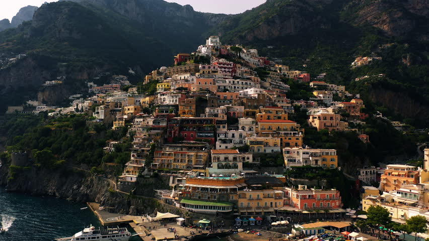 Aerial view away from the houses in the Positano village, in Amalfi coast, Italy - reverse, drone shot
