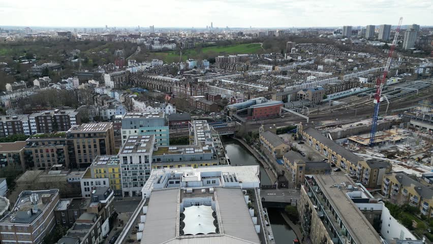 Regents canal apartments buildings Primrose hill in background London UK aerial drone Royalty-Free Stock Footage #1102221379