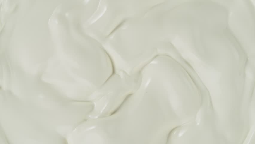 Super slow motion of whirling and pouring milk cream. Filmed on high speed cinema camera, 1000fps. Royalty-Free Stock Footage #1102222613