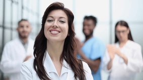 Successful team of different doctors clapping hands - Powered by Shutterstock - Get 15% off with code: PIKWIZARD15