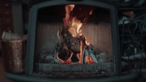 Cinematic Footage of a Cozy Firewood Burning and Crackling in a Rustic Wood Cabin