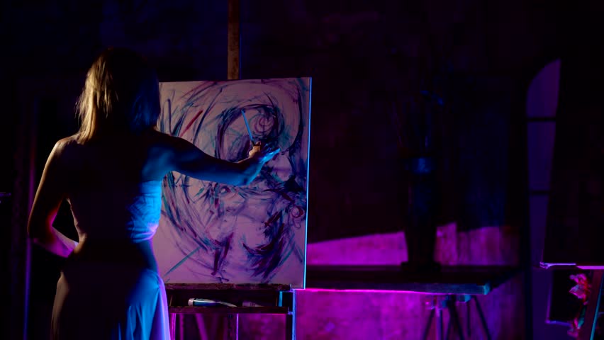 abstract painting and creativity, extravagant female artist drawing in studio at night, back view Royalty-Free Stock Footage #1102232855
