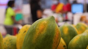 Papaya in supermarket. Close up. - Powered by Shutterstock - Get 15% off with code: PIKWIZARD15