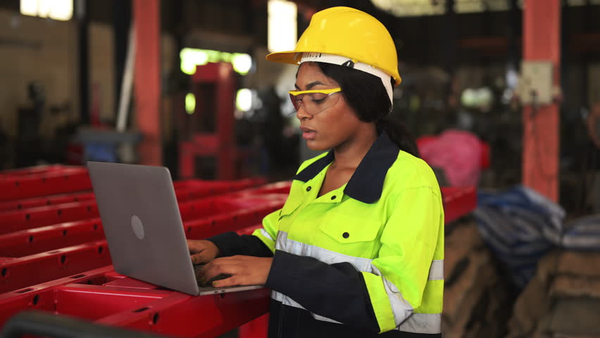 Mechanical maintenance engineer repairing engine machine at factory