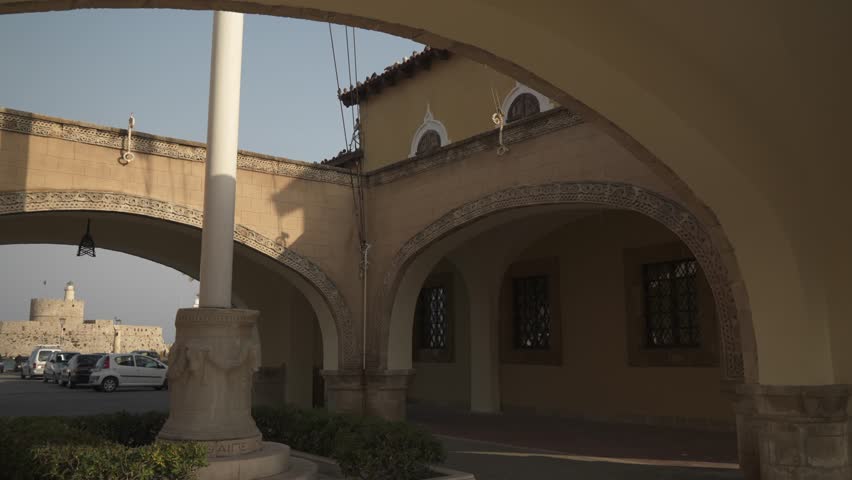 Governors Palace and Saint Nicholas Fortress and Mandraki Harbour boats, Rhodes Town, Rhodes, Dodecanese Islands, Greek Islands, Greece, Europe
