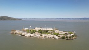 Alcatraz Island in San Francisco Bay. Drone video during the day. Rotate around island