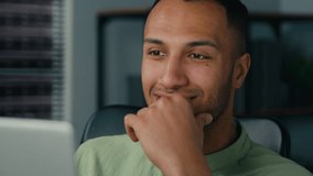 Close-up happy african american man look at laptop screen in office businessman freelancer work on internet use computer ponder message getting good news on social network smiling think analyze online - Powered by Shutterstock - Get 15% off with code: PIKWIZARD15