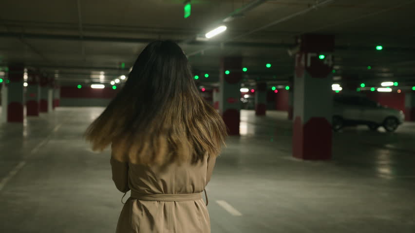 Back view frightened Asian woman scared girl running in parking dark underground subway afraid stressful lady victim feel panic run from pursuit threat dangerous chase alone female walking look behind Royalty-Free Stock Footage #1102244607