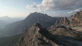 Aerial video over the Dolomites mountain range, on a sunny day. Northern Italy Tyrol