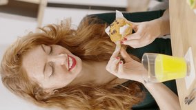 Beauty woman eating a muffin at home