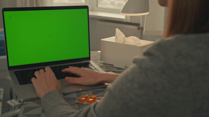 patient using laptop with green screen online consultation with doctor chatting with therapist
