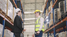 Senior engineer talking with businesswomen and shake hands in warehouse. - Powered by Shutterstock - Get 15% off with code: PIKWIZARD15