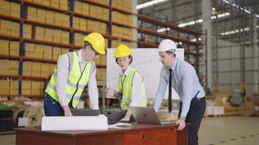 Executive business man and secretary woman talking to asian warehouse manager and looking to computer and laptop in large warehouse - Powered by Shutterstock - Get 15% off with code: PIKWIZARD15
