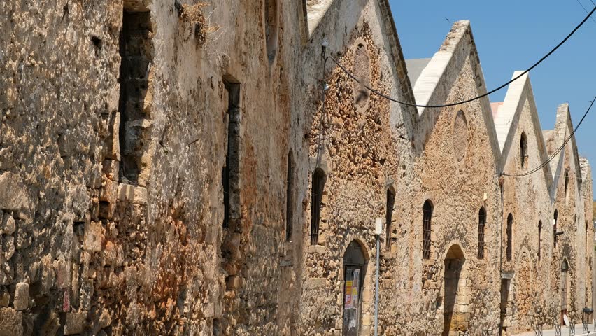 Video of the swallows nesting under the roofs rushing around the buildings of the old 16th-century Venetian arsenal in Chania harbor. Crete. Greece swallows rush Royalty-Free Stock Footage #1102258177
