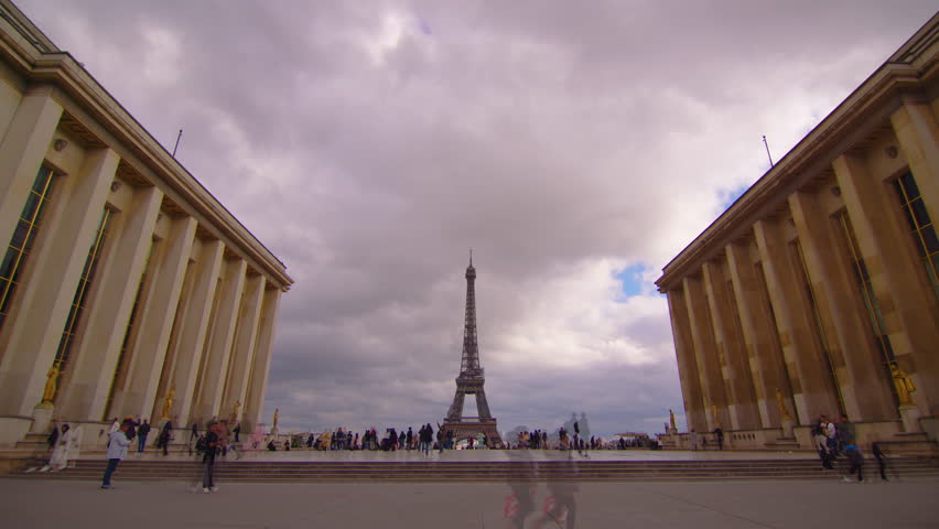 Famous square Trocadero with Eiffel tower in the background time lapse. Trocadero and Eiffel tower are the most visited attractions of Paris. Blue cloudy sky on background. Area after restoration Royalty-Free Stock Footage #1102260615