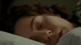 Portrait of a young woman who sleeps wakes up early in the morning from the sound of an alarm clock. The girl lies in bed does not want to get up she is tired and depressed. Sleepy woman waking up
 - Powered by Shutterstock - Get 15% off with code: PIKWIZARD15