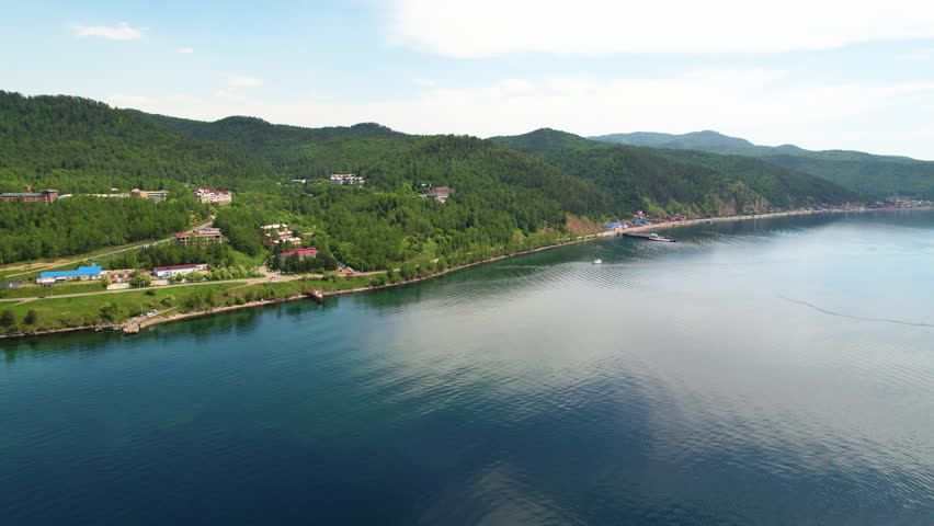 Panorama of Lake Baikal from the air. Listvyanka village.